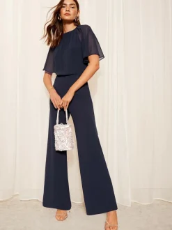Friends Like These Chiffon Flutter Sleeve Scuba Jumpsuit Navy Blue Best
