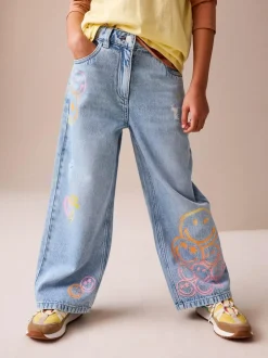 Next Mid Blue SmileyWorld® Print Wide Leg Jeans (3-16yrs) Online