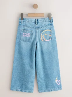 Next Mid Blue SmileyWorld® Print Wide Leg Jeans (3-16yrs) Online