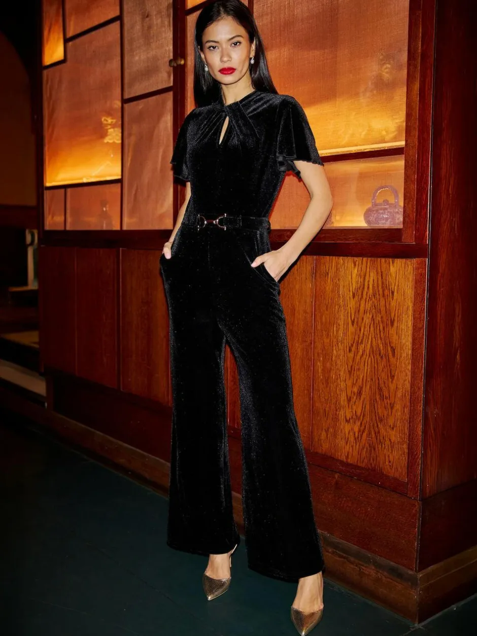 Yumi Black Velvet Jumpsuit With Twist Neckline And Buckle Belt